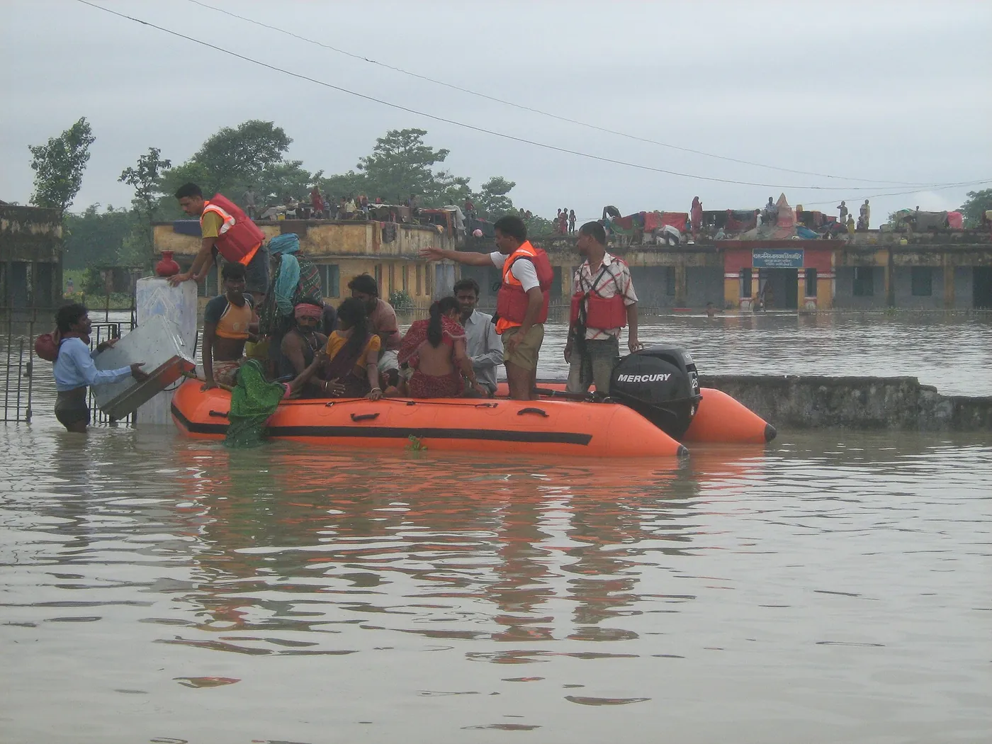 NDRF rescuers in an inflatable boat during a flood in Bihar
