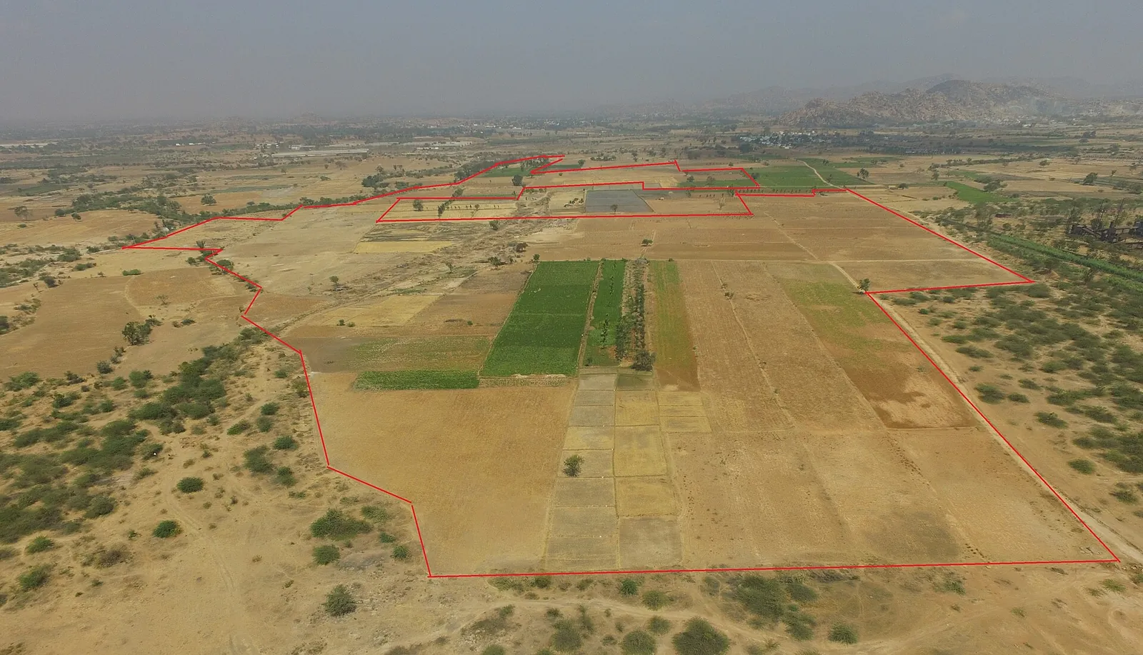 Aerial view of a solar plant among farmland in Karnataka